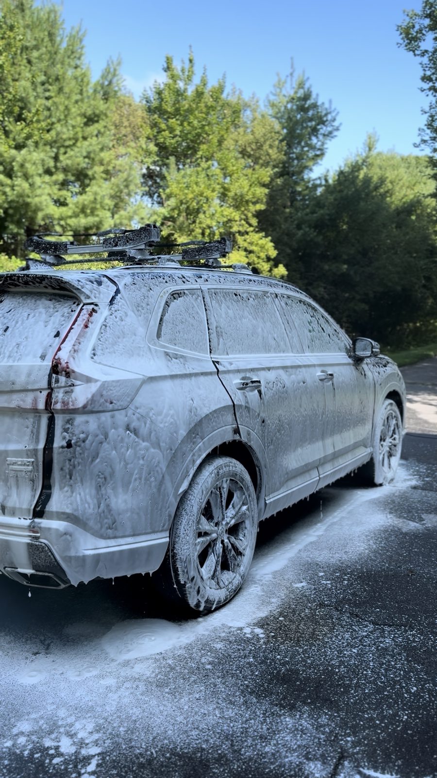 Honda CR-V covered head to toe in thick white foam during the pre-wash stage of a detail